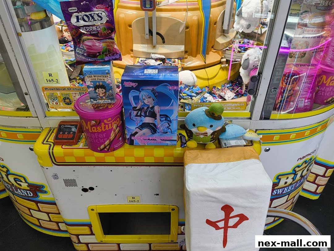 A claw machine filled with plush toys, candy, and anime figures.