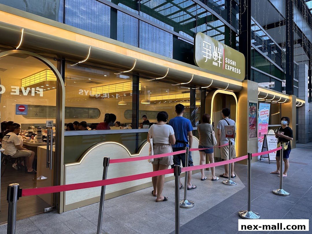 People queuing outside Sushi Express, a modern sushi restaurant with a clean facade.