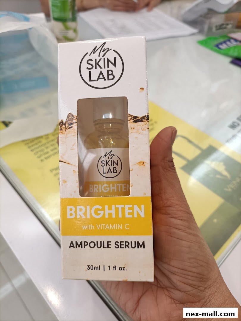 A hand holds a box of My Skin Lab Brighten Ampoule Serum with Vitamin C.