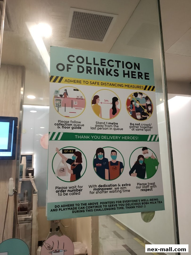 A sign at PlayMade detailing safe distancing measures for drink collection.