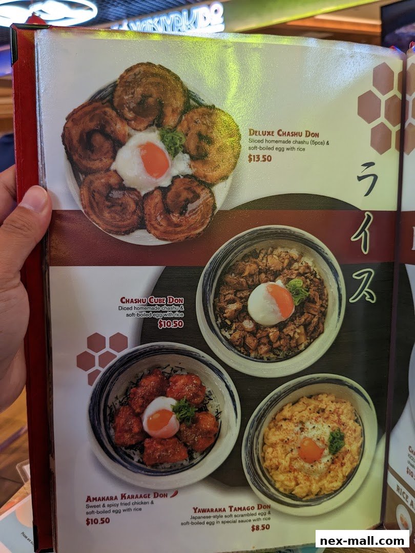 A menu featuring various Japanese rice bowls with chashu, karaage, and egg.