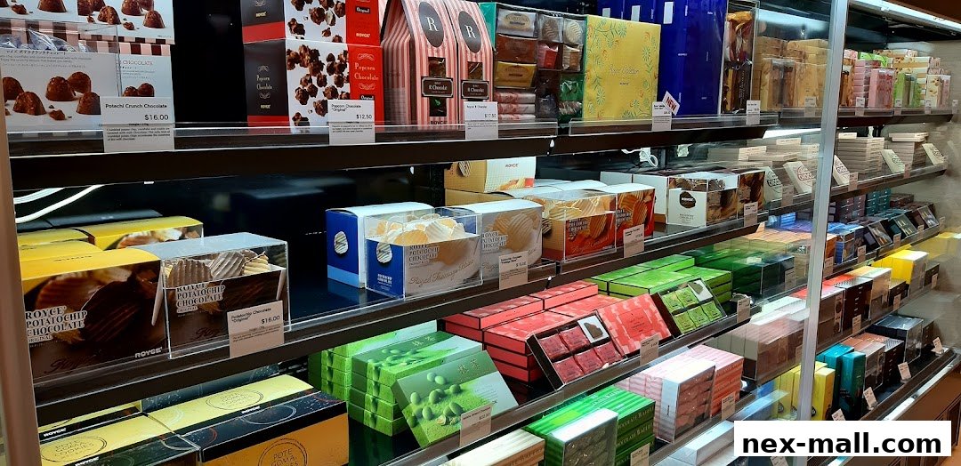 A display of various Royce chocolate products, including potato chip chocolate and popcorn chocolate.
