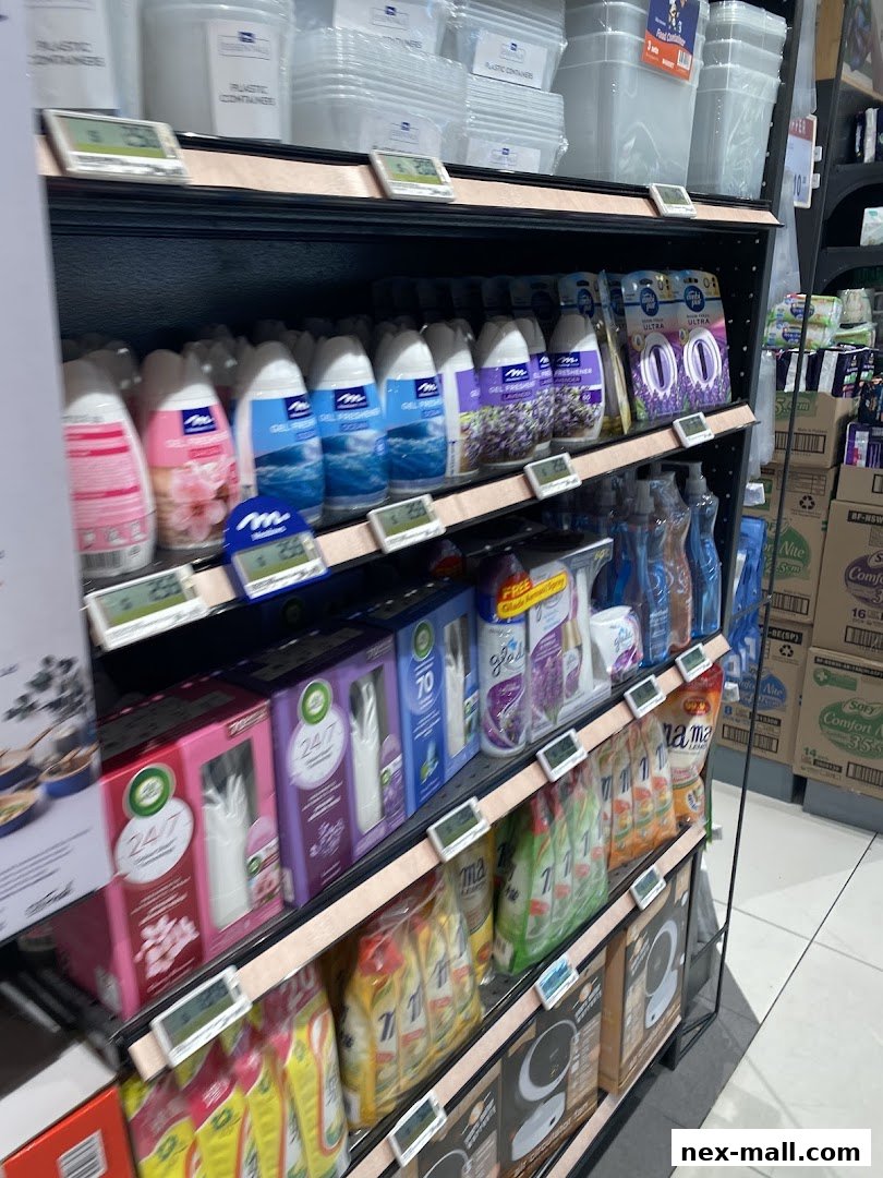 Shelves stocked with household cleaning and air freshening products, including bottles and packaged items.