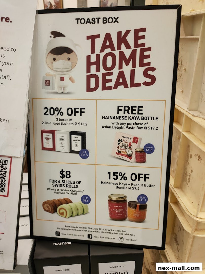 A promotional poster for Toast Box's 'Take Home Deals' featuring discounts and free items.