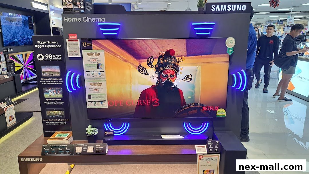 A Samsung Home Cinema display featuring a large TV showcasing a movie with promotional information.