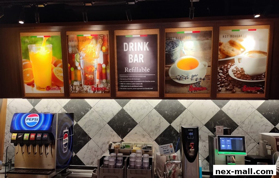 A Saizeriya restaurant's drink bar area with a Pepsi dispenser and various beverage posters.