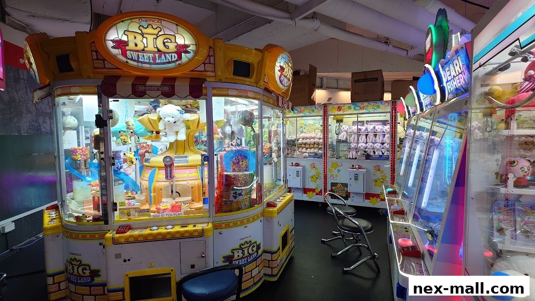 Interior of an arcade with various claw machines filled with plush toys and prizes.
