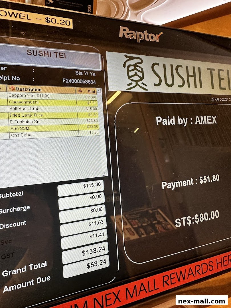 A close-up of a Sushi Tei receipt and payment screen.