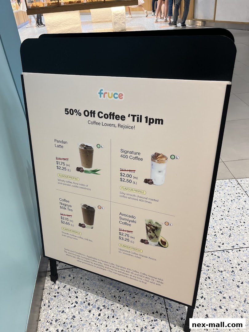 A menu board advertising Fruce's coffee drinks with a 50% off promotion.