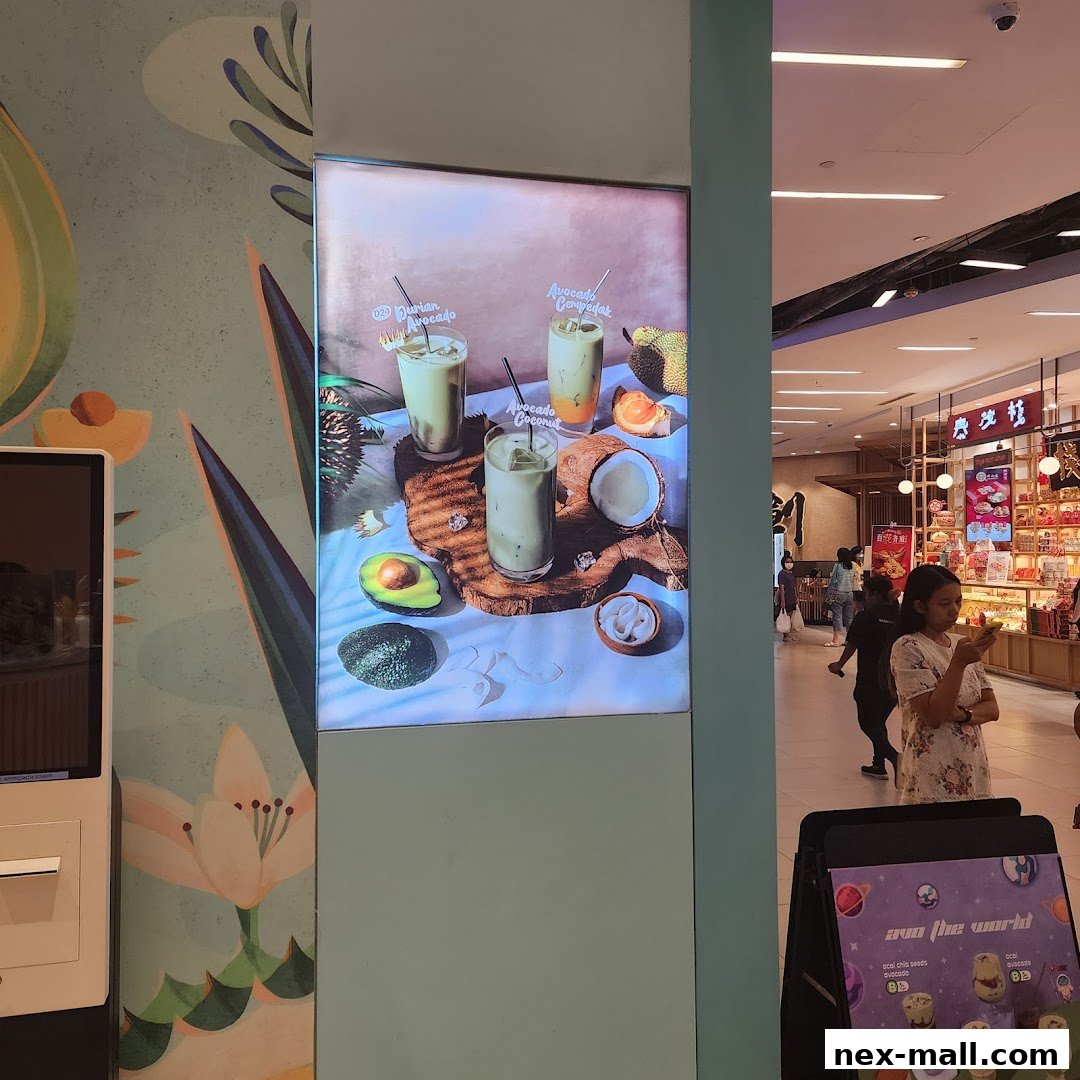 A digital display showcasing three avocado-based drinks with fruits and ingredients.