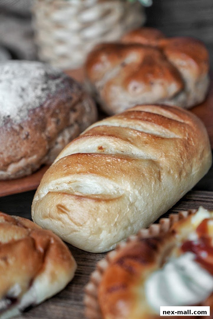 A close-up shot of various freshly baked Japanese breads and pastries.