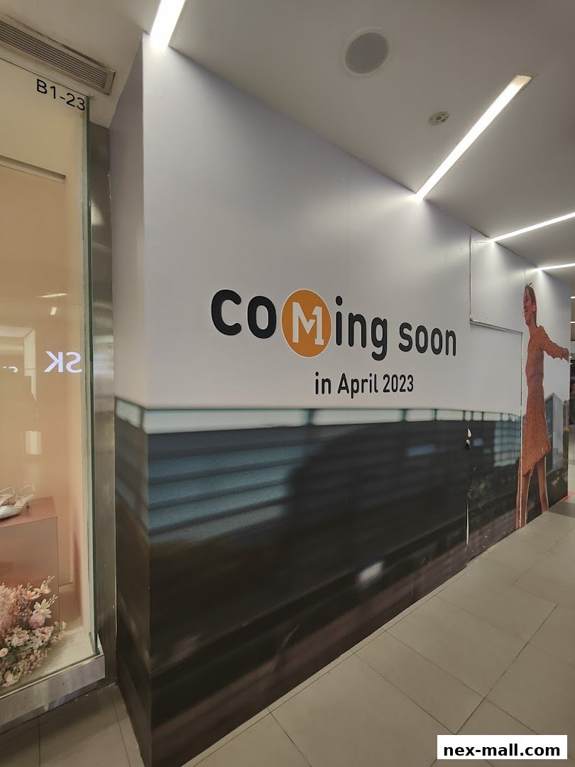 A shop front with a 'Coming Soon' banner and a display window with flowers and shoes.