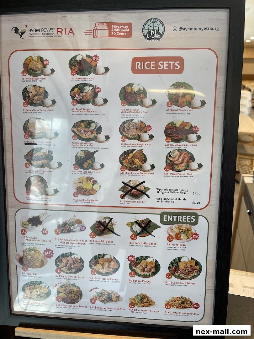 A menu board for Ayam Penyet Ria featuring rice sets and entrees with pictures and prices.