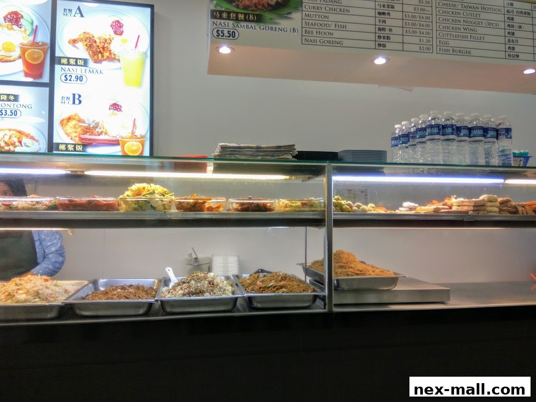 A display of food items and a menu board at a food stall.