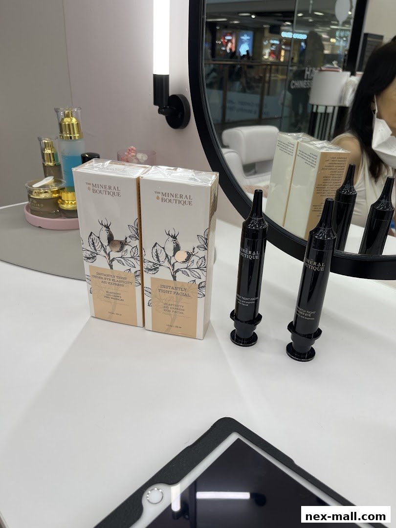 The Mineral Boutique products displayed on a white surface with a mirror reflecting the mall.