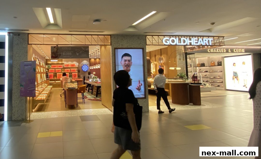 The Goldheart Jewelry store interior with displays of jewelry and a digital advertisement.