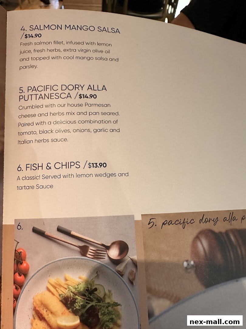 A menu from Hot Tomato featuring Salmon Mango Salsa, Pacific Dory Alla Puttanesca, and Fish & Chips.