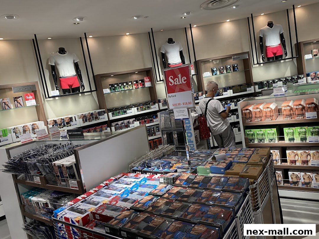 Interior view of a men's underwear store with mannequins and displays of various brands.