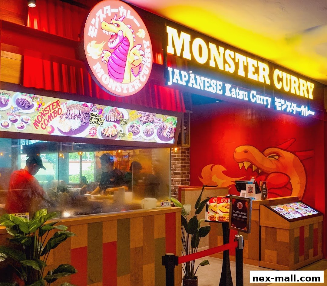 The exterior of Monster Curry, a Japanese Katsu Curry restaurant, with a dragon logo and menu displays.