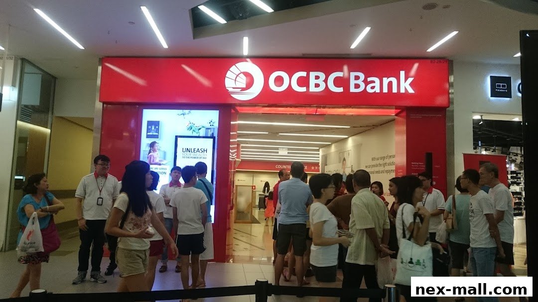 The entrance of OCBC Bank NEX branch with customers queuing inside and outside.