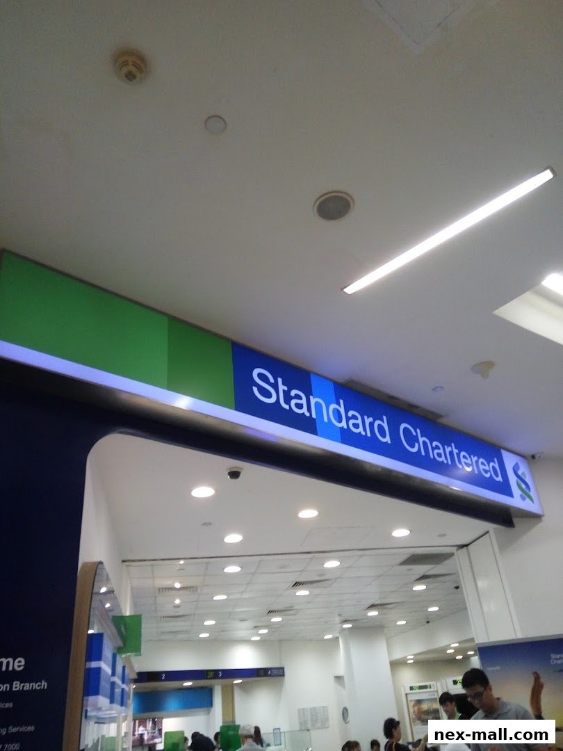The entrance to a Standard Chartered Bank branch with its prominent signage.