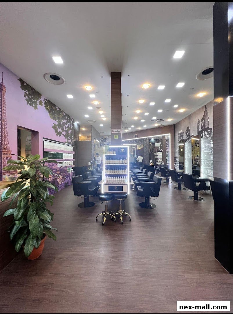 Interior view of a modern hair salon with styling chairs and product displays.