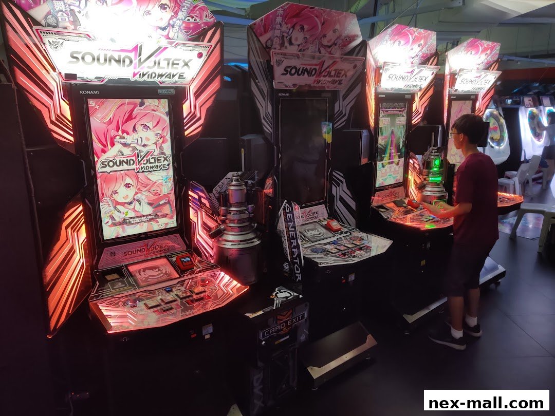 A person plays a rhythm game on a Sound Voltex arcade machine.