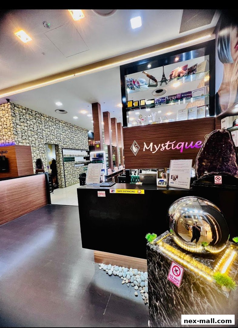 Interior view of Mystique Hub International, a shop with a reception desk and display shelves.
