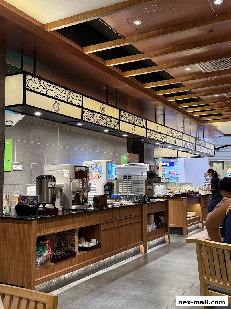 Interior view of Shabu Sai restaurant with a buffet counter and seating.