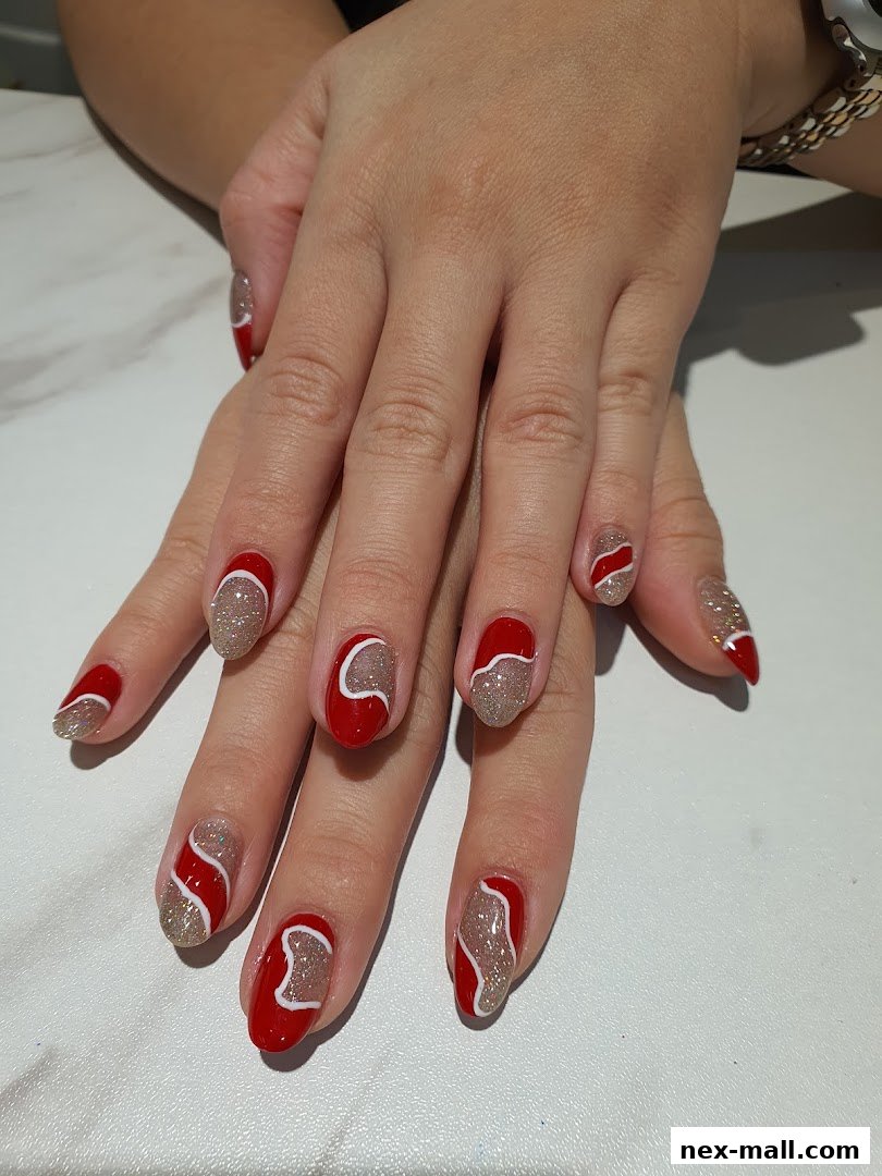 A close-up of hands with beautifully designed red and glittery nails.