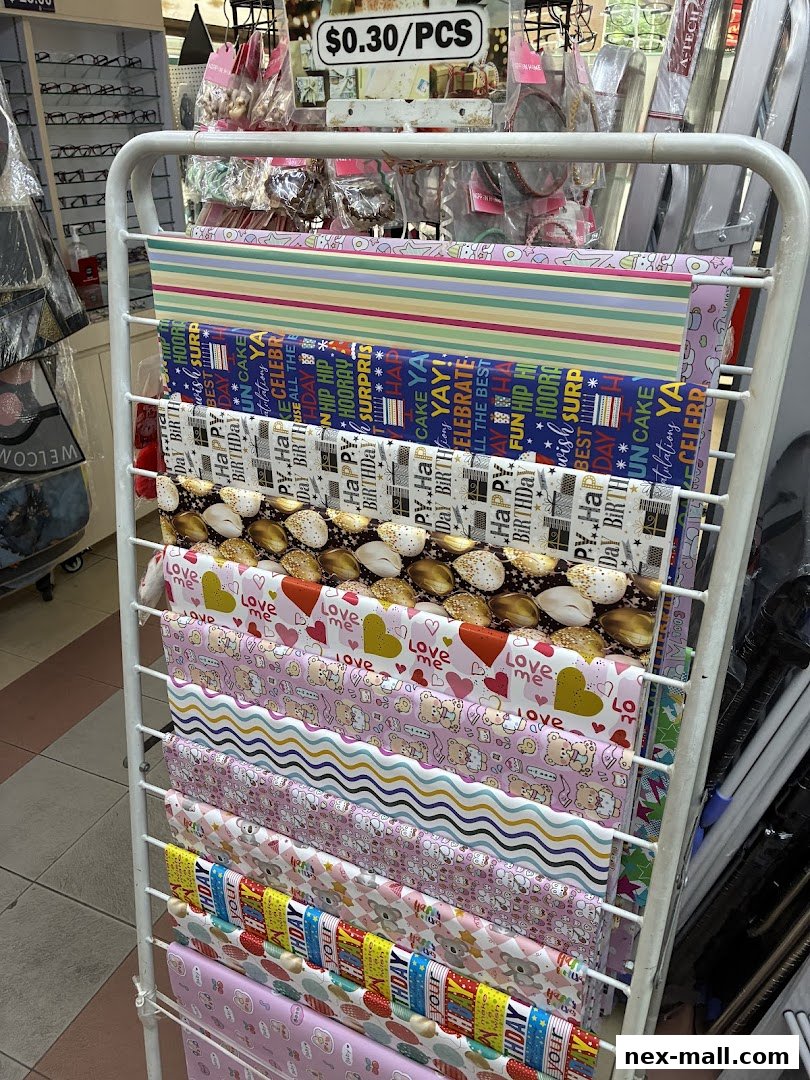 A rack displaying various rolls of colorful wrapping paper with different patterns and themes.