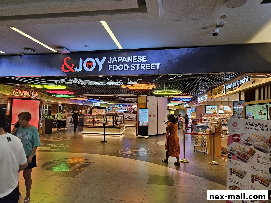 Entrance to a Japanese food street with various food stalls and signage.
