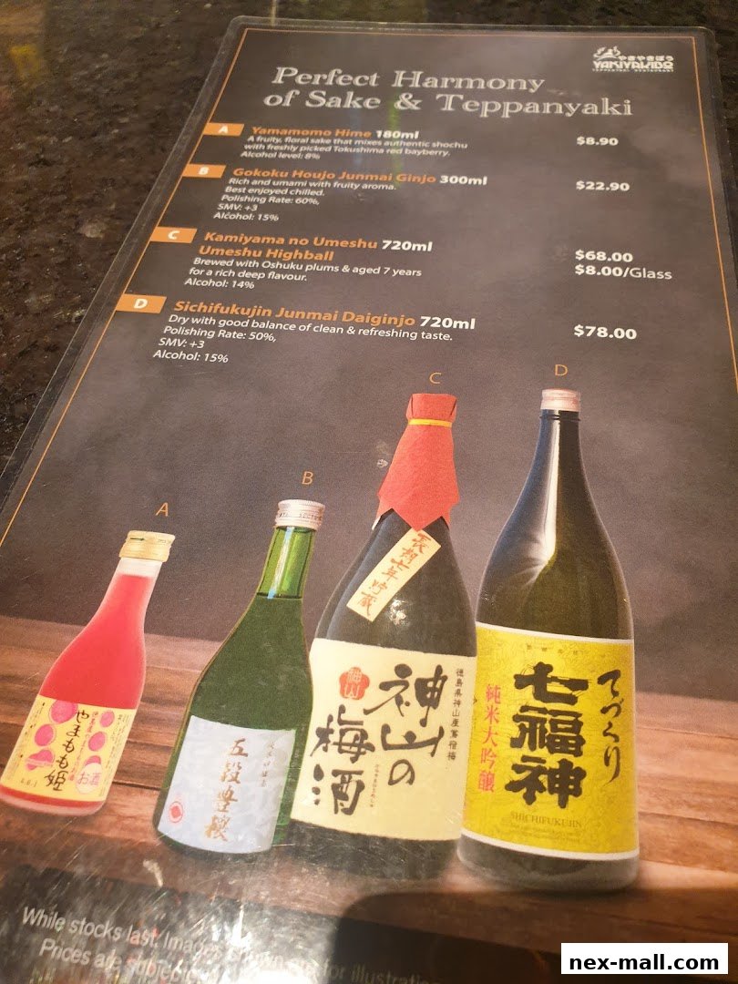 A menu featuring sake and teppanyaki with images of sake bottles.
