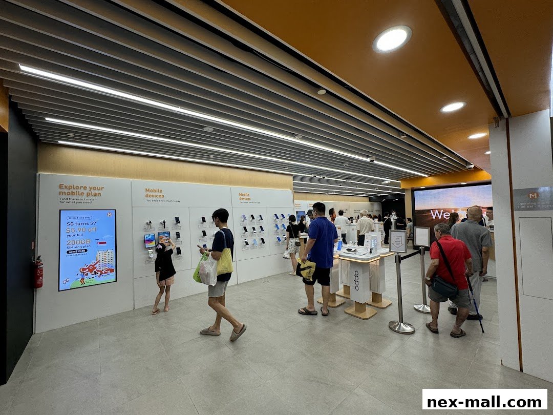 People browsing mobile phones and plans inside a brightly lit M1 NEX shop.