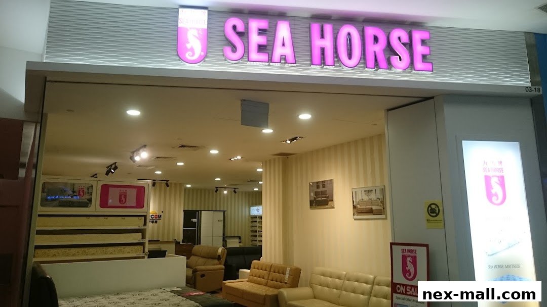 The Sea Horse store entrance displays its brand name and showcases various furniture items like mattresses and sofas.