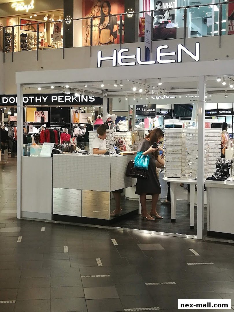 A retail kiosk with various accessories and clothing brands displayed.