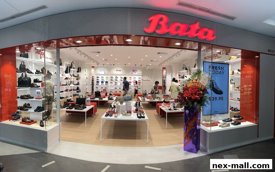 The Bata shoe store features a wide selection of footwear displayed on shelves and tables, with a prominent red logo.