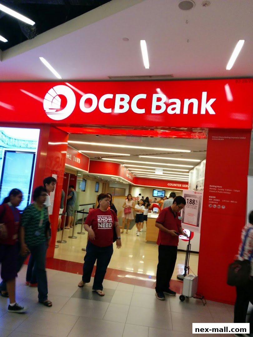 The entrance of OCBC Bank NEX branch with customers inside and outside.