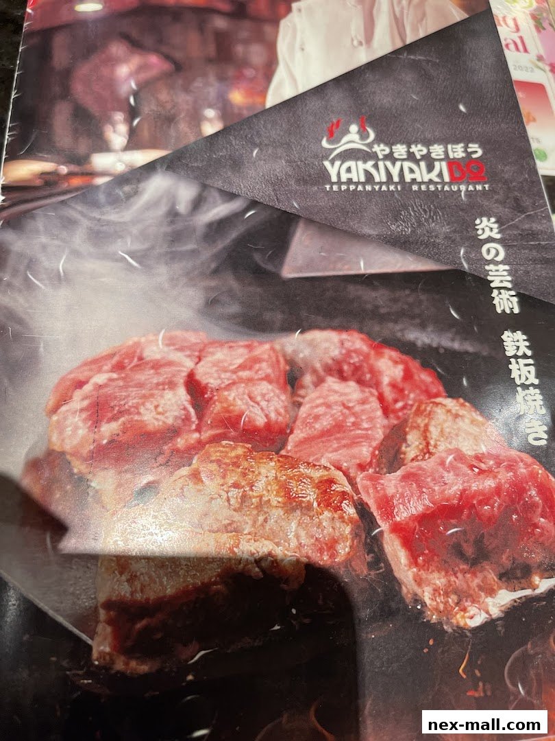 A menu cover for Yaki Yaki Bo Teppanyaki Restaurant featuring sizzling steak.