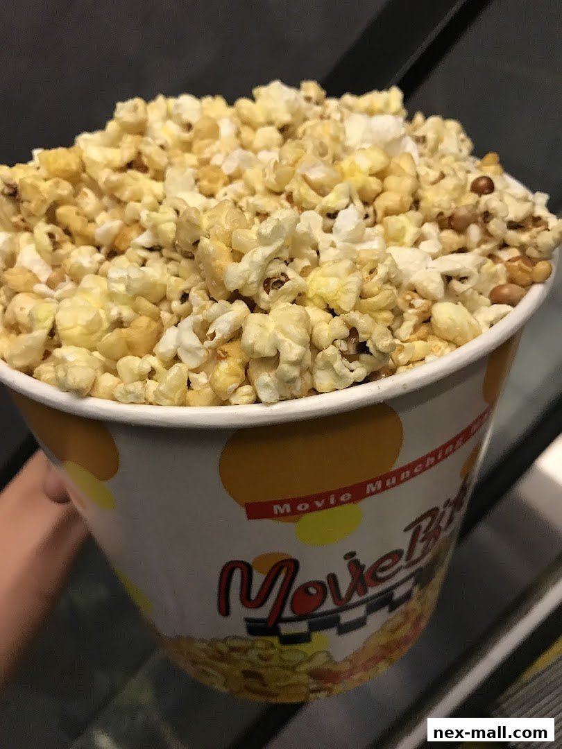 A close-up shot of a large bucket of popcorn with the 'Movie Munchies' logo visible.