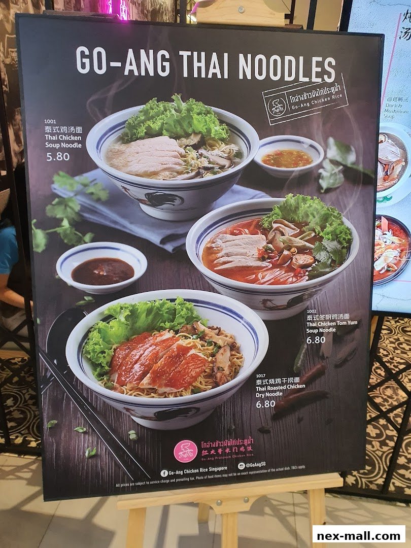 A menu board displays various Thai noodle dishes with prices and images.