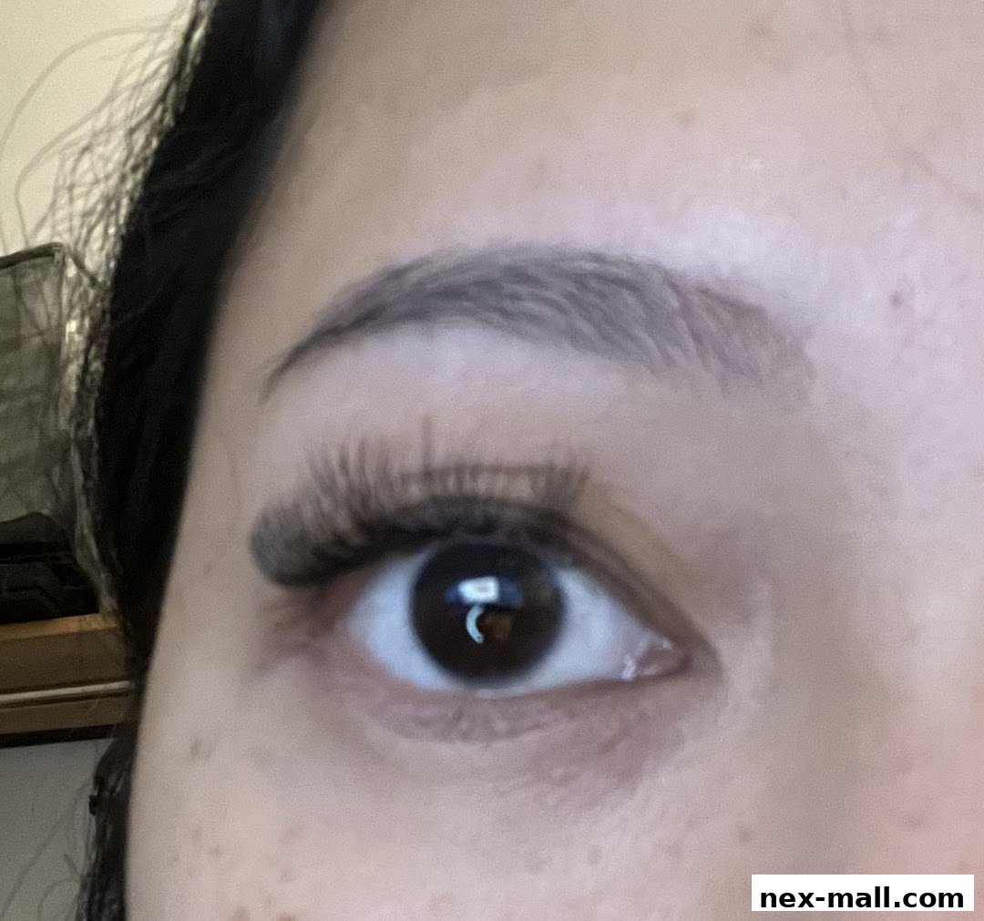 Close-up of a woman's eye with beautifully applied eyelash extensions.
