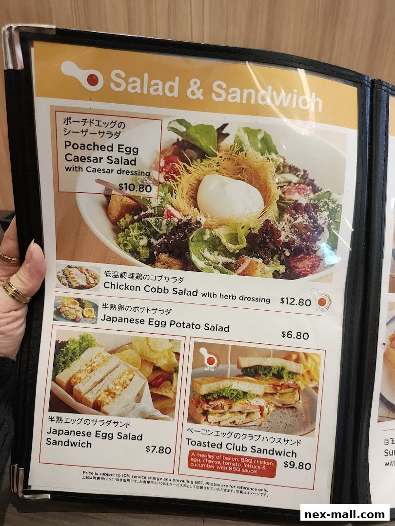 A menu featuring salads and sandwiches with appealing food photography.
