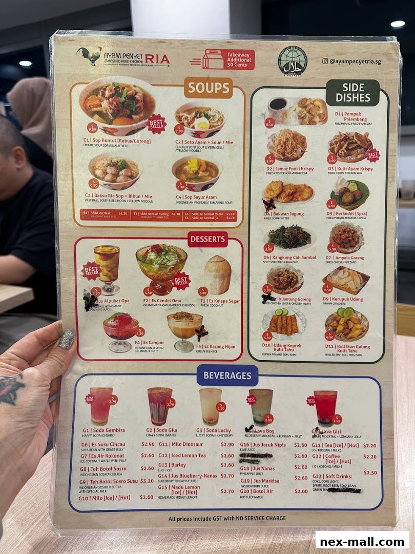 A menu from Ayam Penyet Ria featuring soups, side dishes, desserts, and beverages.