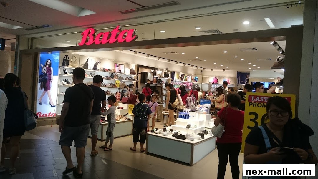 A Bata shoe store with customers browsing footwear and accessories.