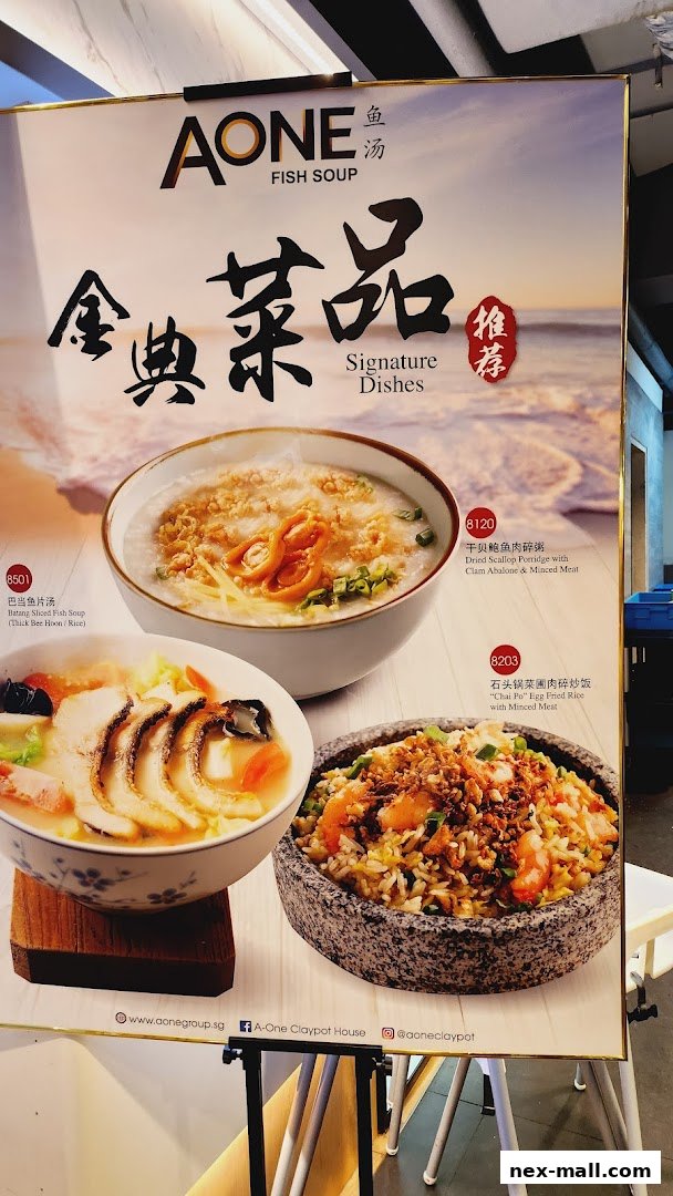 A menu board showcasing signature fish soup dishes and fried rice from A-One.