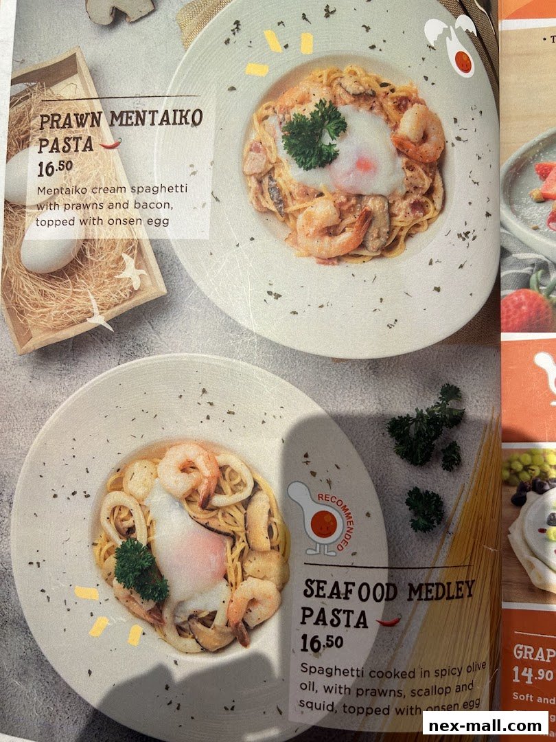 A menu featuring two pasta dishes: Prawn Mentaiko Pasta and Seafood Medley Pasta.