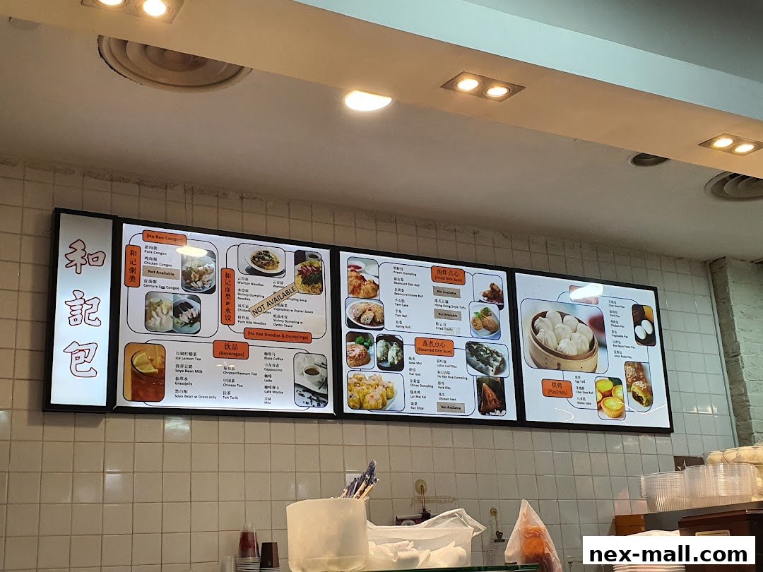 A digital menu board displaying various food and drink items from Ho Kee Pau.
