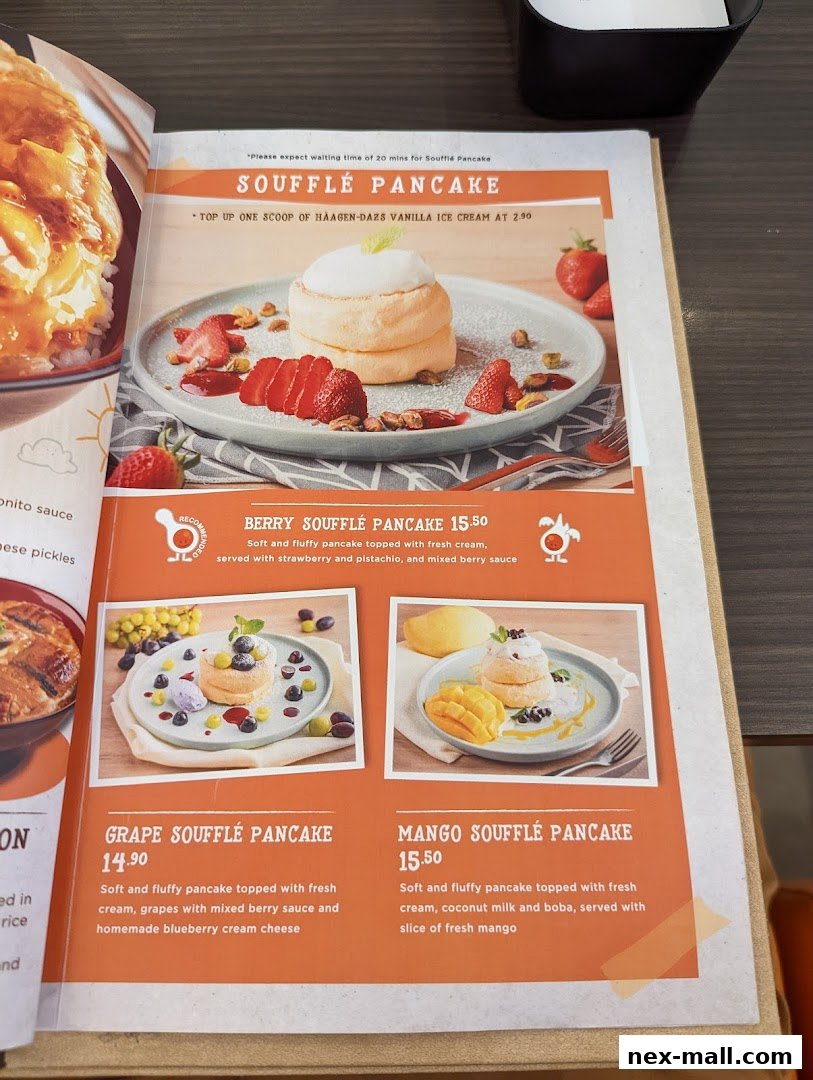 A menu featuring various flavors of soufflé pancakes with detailed descriptions and prices.
