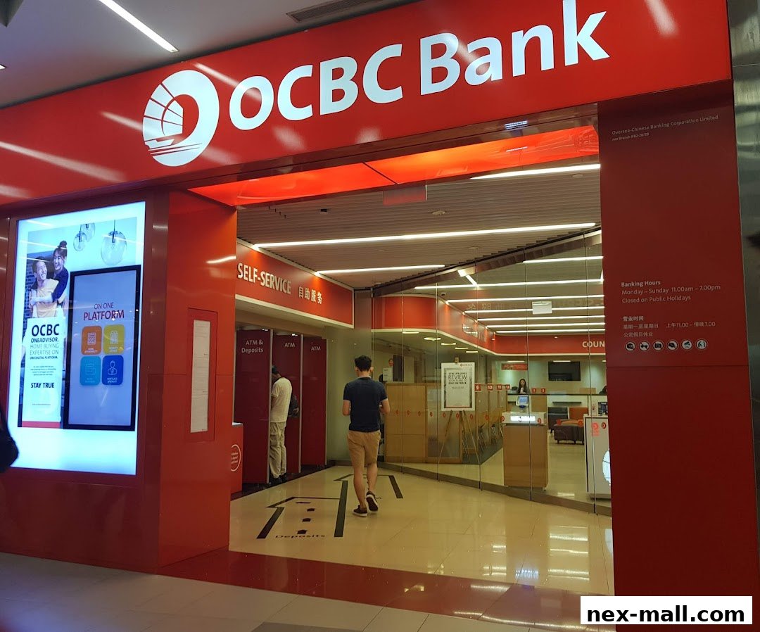 The entrance to OCBC Bank NEX, featuring the bank's logo, self-service area, and banking hours.